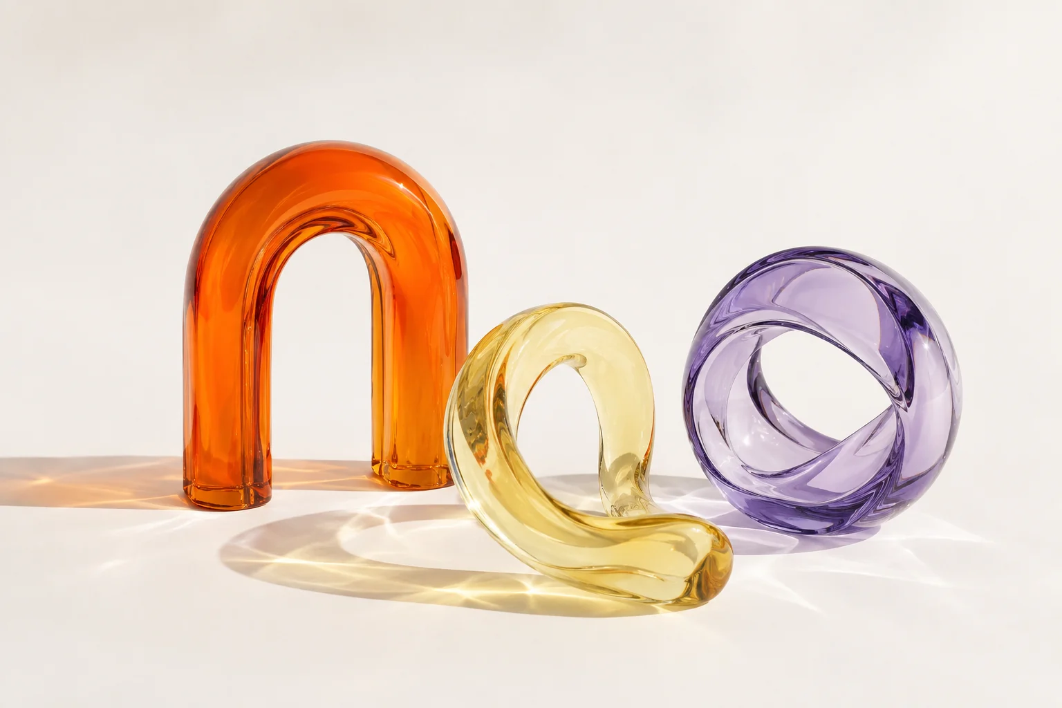 Orange, butter-yellow and lavender glass sculptures, created for Usefully Yours